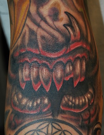 Marvin Silva - evil mouth with torn lip tattoo