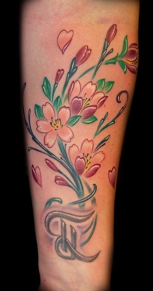 She asked for cherry blossoms to add to her existing letter tattoo on the