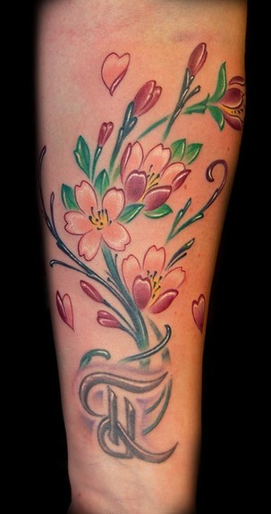 She asked for cherry blossoms to add to her existing letter tattoo on the She asked for cherry blossoms to add to her existing letter tattoo on the