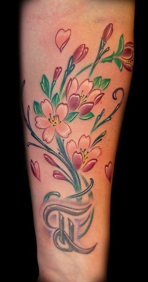 She asked for cherry blossoms to add to her existing letter tattoo on the 