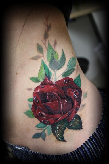 Rose tattoo on hip