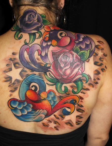 http://www.galleryoftattoosnow.com/LuckieLeopardHOSTED/images/gallery/medium/bird%20back%20piece.jpg