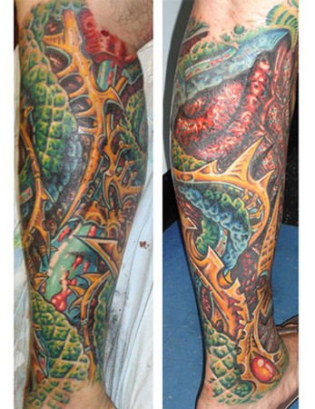 tattoo on upper leg. bio-organic half sleeve leg