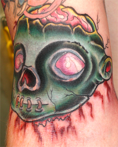 Jason Ackerman - severed head stitched mouth brained zombie