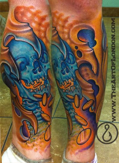 This skull biomech tattoo represents the greed associated with money and is 