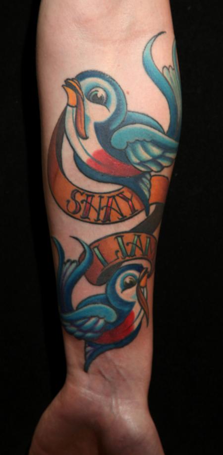 Mario Rosenau - traditional colored swallows with banner tattoo