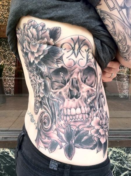 Megan Hoogland - Skull and Flowers Ribs Tattoo