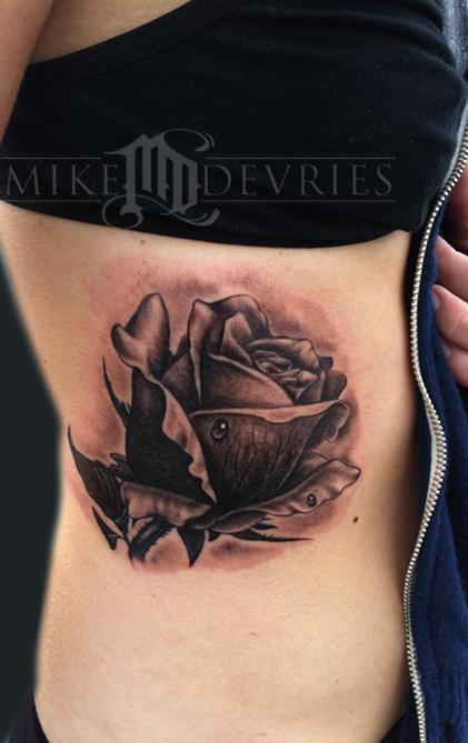 Black and grey Rose Tattoo on the ribs We may possibly add another one