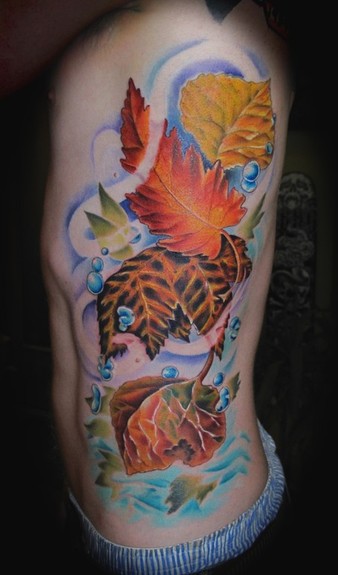 Leaf and water rib tattoo