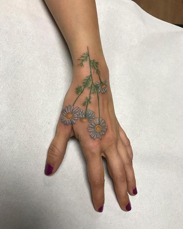 Flowers in Color Tattoo on the Hand by Linn Tattoos