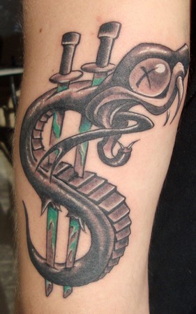 We did this snake tattoo on the back of the tricep area Artist Scott Olive