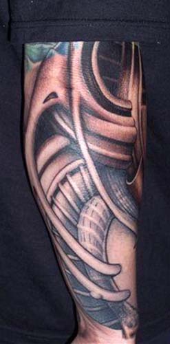 custom black and gray biomechanic arm tattoo