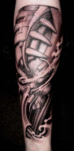 custom black and gray biomechanic skull tattoo