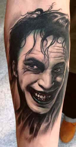 custom black and gray color joker batman portrait tattoo