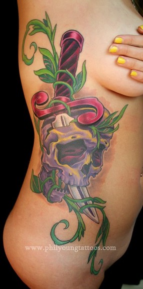 Skull and knife on ribs Skull and knife on ribs