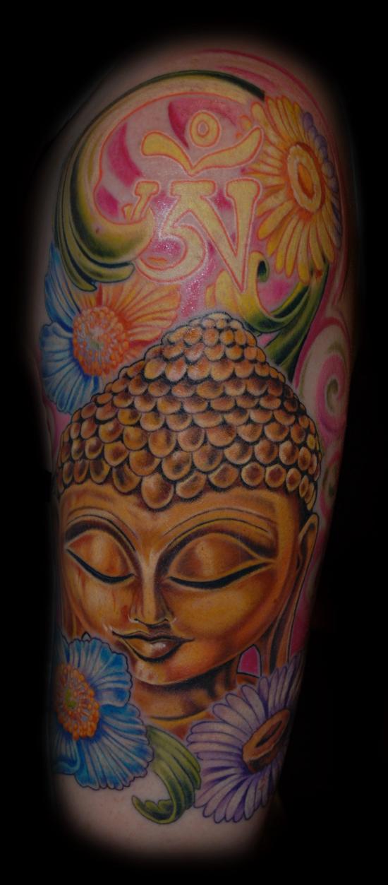 this piece is of a buddha statue with a glowing ohm and flowers