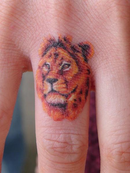 Miniature Lion Knuckle Tattoo