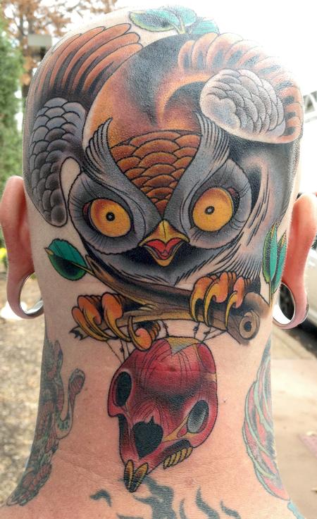Owl and rabbit head tattoo