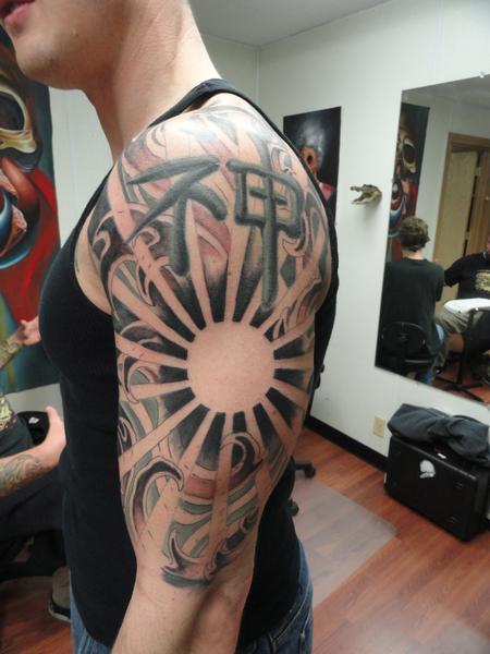 Sun Rays and Cross Tattoo