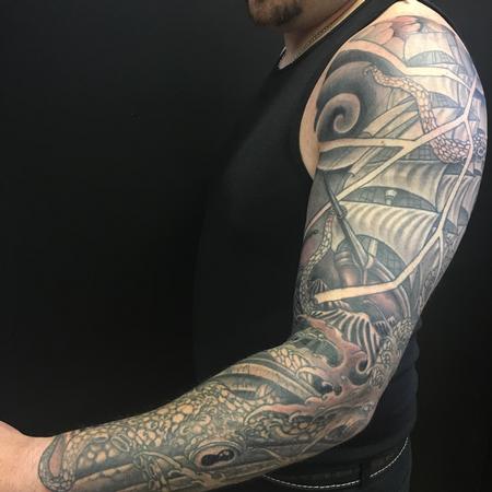Dana Helmuth - ship in stormy seas with kraken black and grey tattoo sleeve