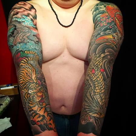 Dana Helmuth - Helmuth matching hawk and tiger sleeve tattoos