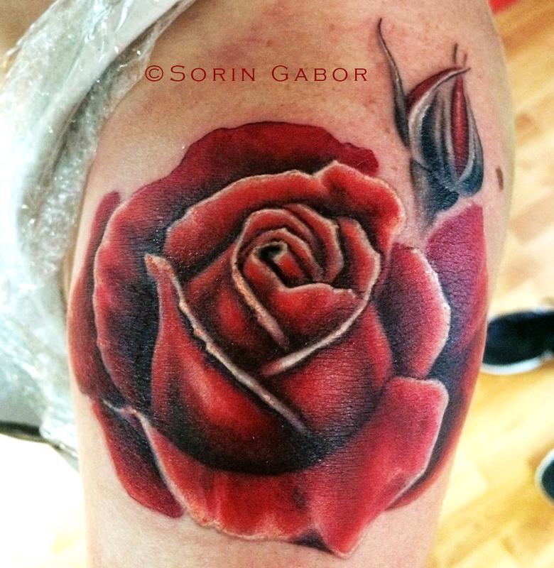 realistic red rose tatoo on shoulder by Sorin Gabor Tattoos