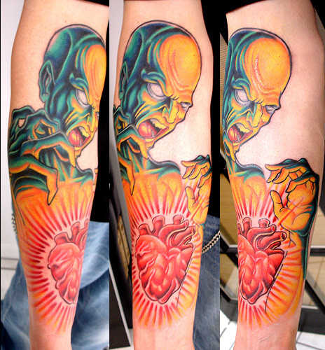 Tattoos - guy with glowing heart - 7838