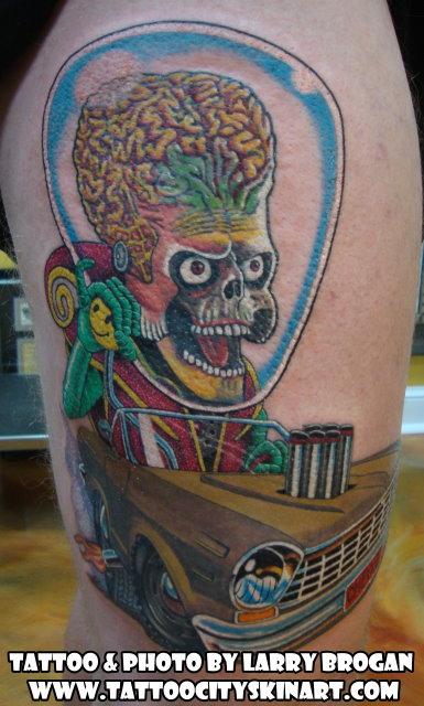 Larry Brogan - Mars Attacks Ambassador driving a 64 Chevy II Rat Fink style.