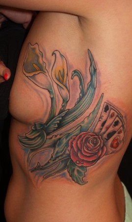 Comments This is a tattoo of calla lilies a rose and playing cards on her 