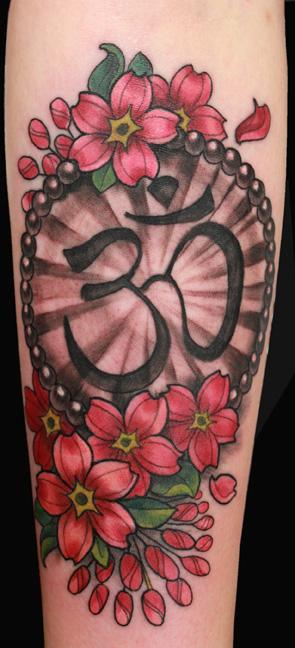 Katelyn Crane - Om and cherry blossom tattoo