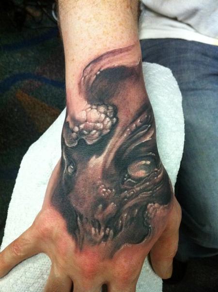 Evil hand tattoo