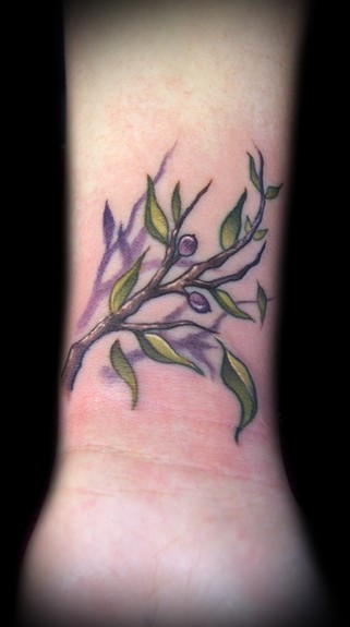 Kelly Doty - Tiny Olive Branch tattoo
