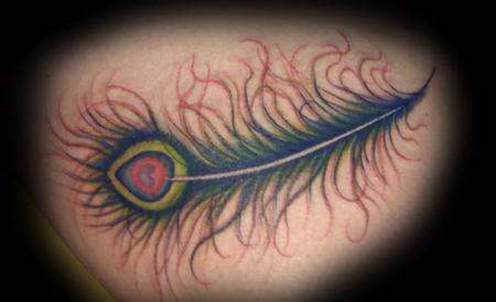 Peacock feather tattoo on a female clients thigh Tattoo by Eli