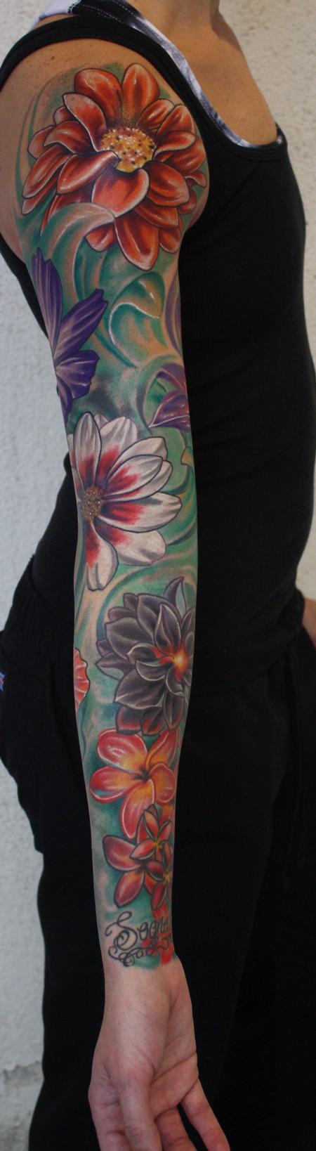 Ty McEwen color flower sleeve tattoo
