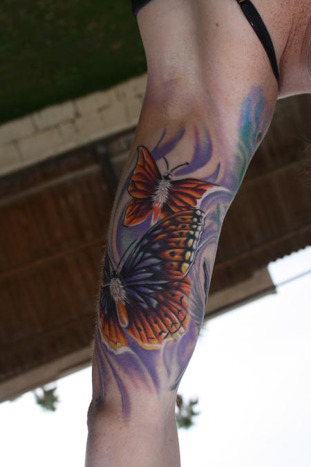 Ty McEwen - butterfly tattoo