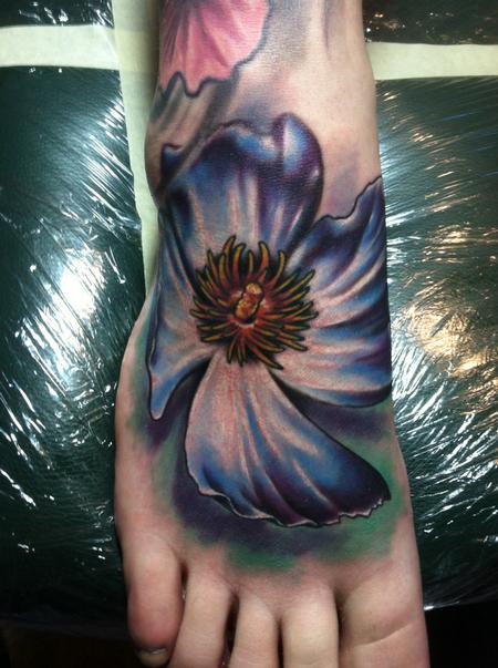 Ty McEwen - flower foot tattoo