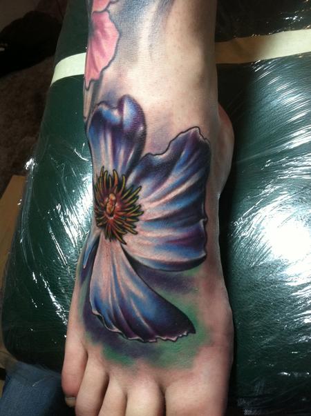 Ty McEwen - foot color flower tattoo