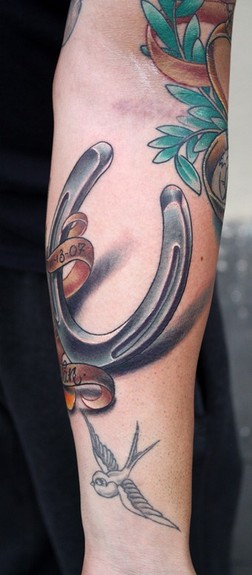 Ty McEwen - horseshoe tattoo