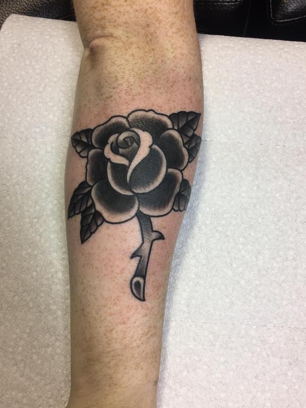 Traditional black rose by Dylan Talbert Davenport Tattoos