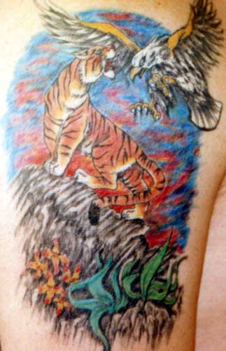 Really bad tattoo Eagle fighting Tiger Leave Comment
