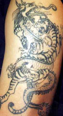 tattoo tiger. Really bad tattoo - tiger and