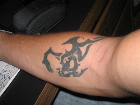  Tatoos on Bad Tattoos   Tribal Dragon Blowing Himself