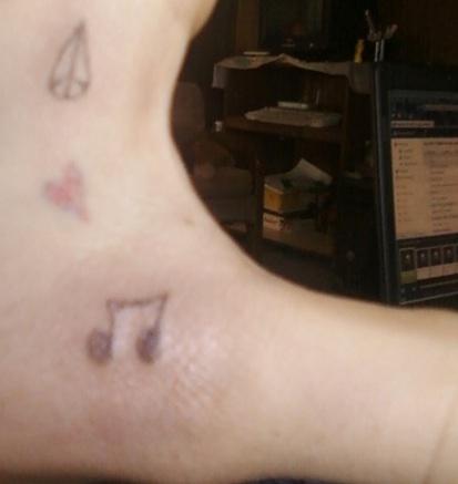 Bad Tattoos - Upside down diamond loves music.