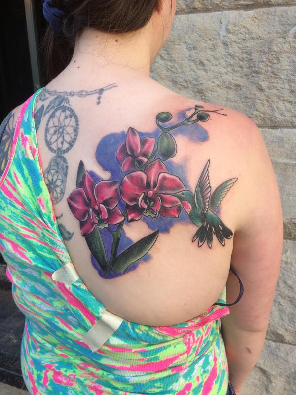 Orchids, hummingbird by Chuck Day Tattoos