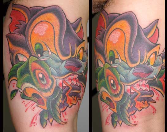 Looking for unique  Tattoos? Cat gets Parrot 