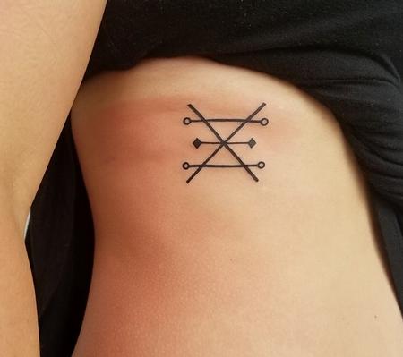 Tattoos - Symbol Tattoo on Ribs - 129391