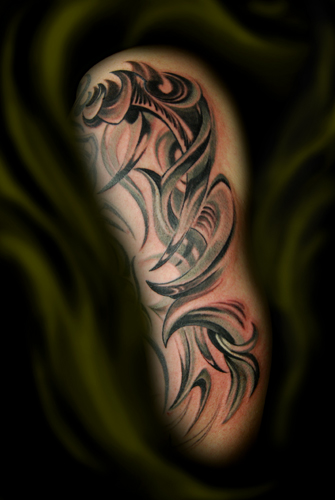 This is a half sleeve tattoo in progress with some tribalistic ornament