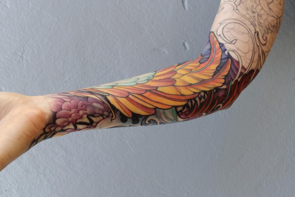 Tattoos - feathers and fangs - 115554