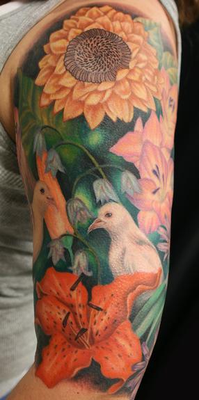 Looking for unique Jesso Tattoos?  ericas flower half sleeve