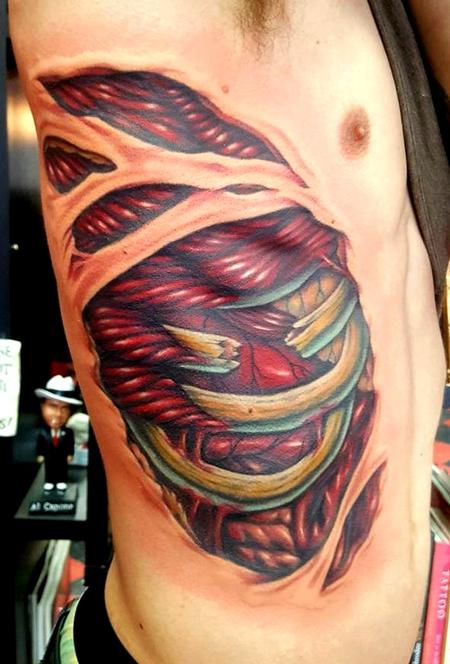 Jesse Neumann - side rip tattoo